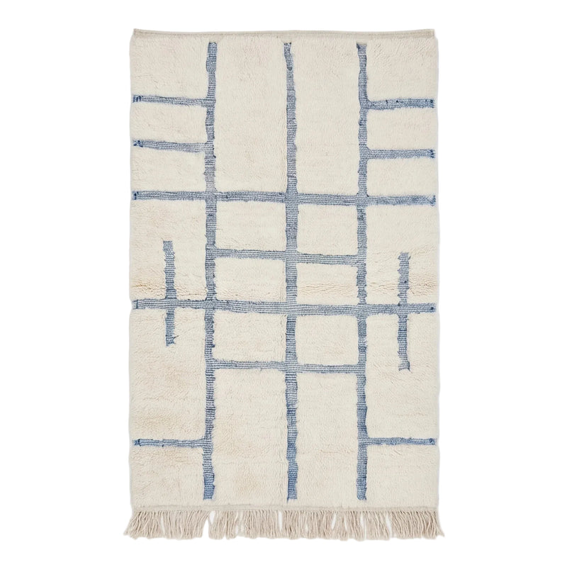 Tapis Béni Ouarain écru à motif graphique bleu, vue de dessus