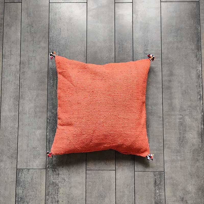 coussin à pompons orange