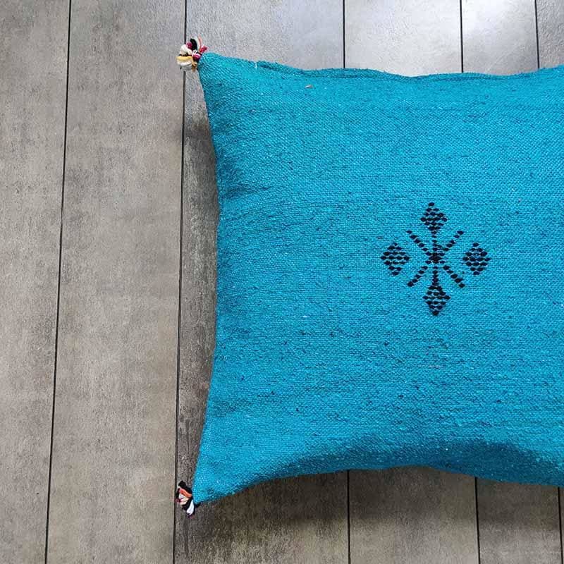 housse de coussin pompon bleu