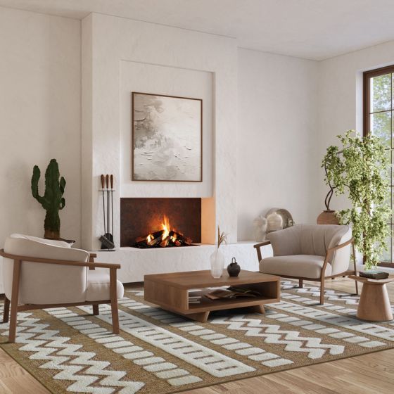 Tapis contemporain en jute beige à motifs géométriques zigzag et bandes blanches, dans un salon lumineux.