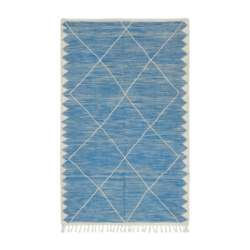 Tapis Zanafi bleu avec motif losanges blancs parsemé sur un fond tissé texturé.