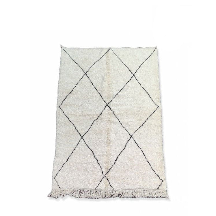 tapis berbere et tabouret en bois