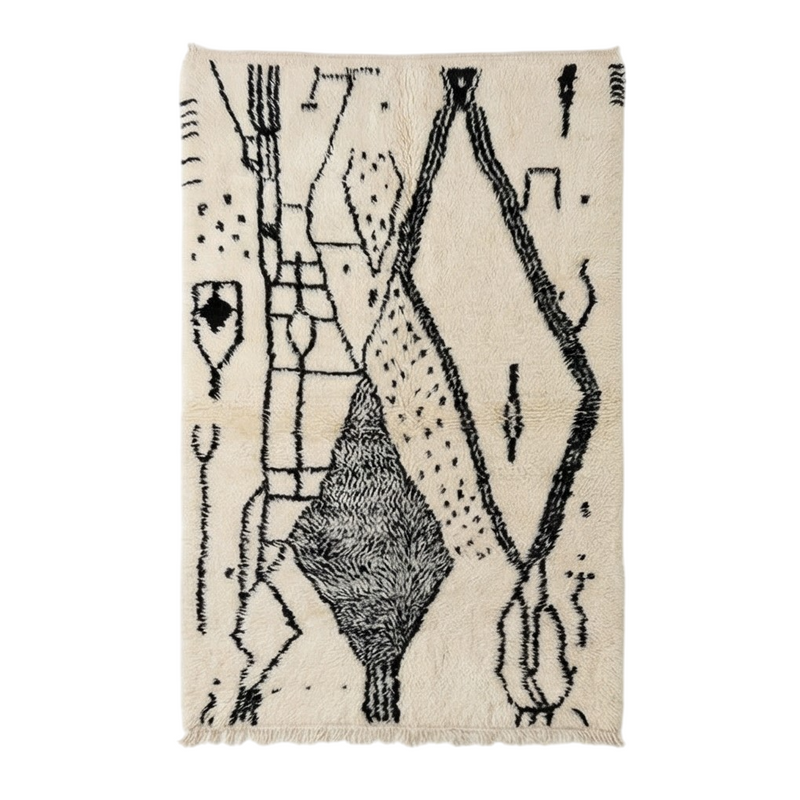 Tapis Azilal noir et blanc, de style marocain, avec motifs géométriques et franges décoratives.

