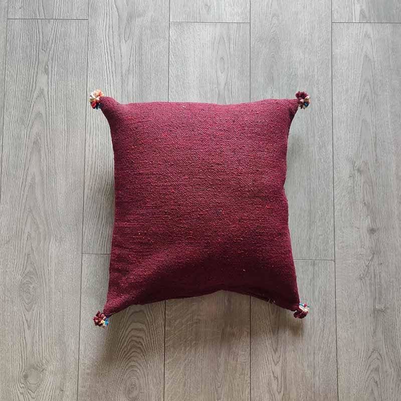 coussin pompon bordeaux