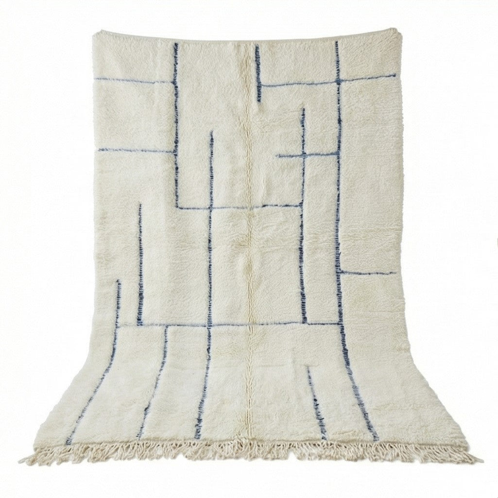 Grand tapis marocain graphique en laine, avec motif géométrique bleu.