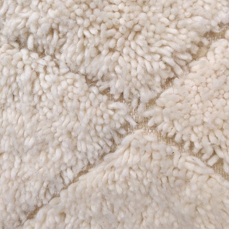 tapis blanc motif creux fait main